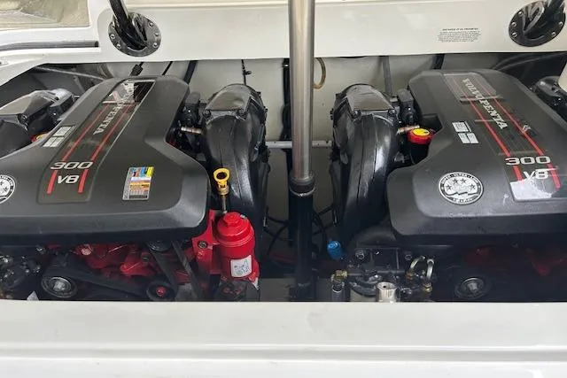 Slide: The Image of 2014 Cobalt 302 boat engine compartment with dual V8 engines. - 10