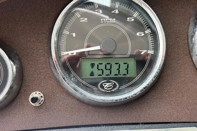 Slide: The Image of Tachometer of 2014 Cobalt 302 showing 593.3 hours on digital display. - 14