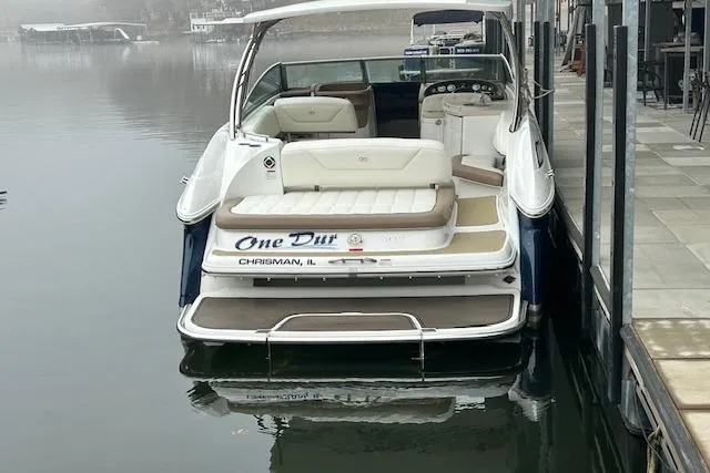 Slide: The Image of 2014 Cobalt 302 boat docked on calm water, rear view. - 3