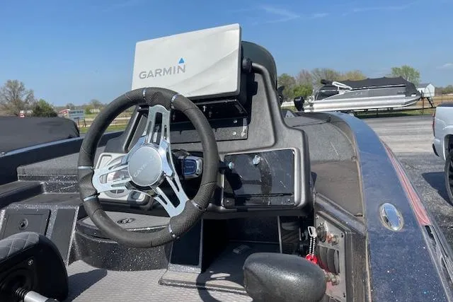 Slide: The Image of 2022 Caymas CX19 boat dashboard with Garmin navigation system and steering wheel. - 3