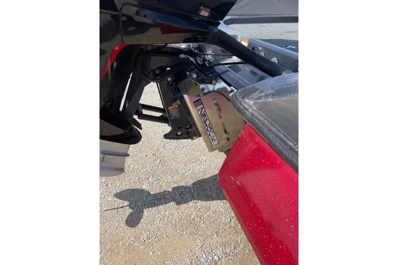 Slide: The Image of 2022 Caymas CX19 boat with a red hull and motor mount detail. - 5