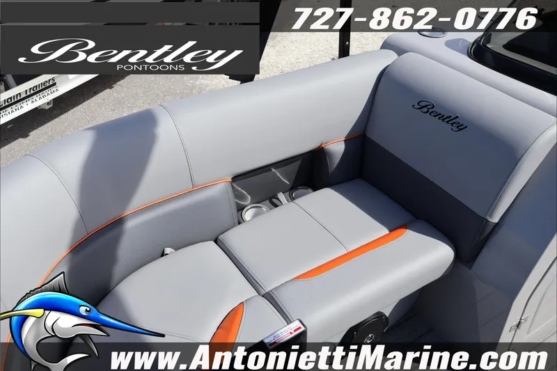 Slide: The Image of 2026 Bentley Pontoons Legacy 203 Swingback with gray and orange seating, displayed by Antonietti Marine. - 17