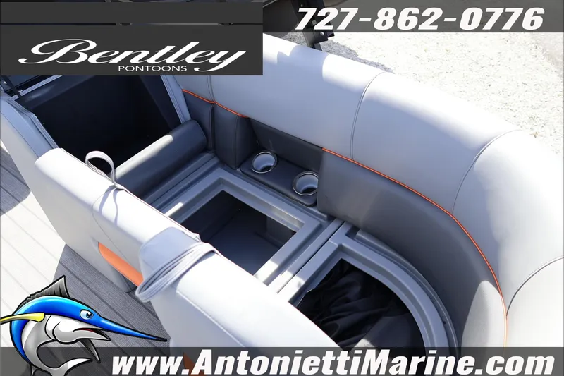 Slide: The Image of 2026 Bentley Pontoons Legacy 203 Swingback interior with gray seating and cup holders. - 18