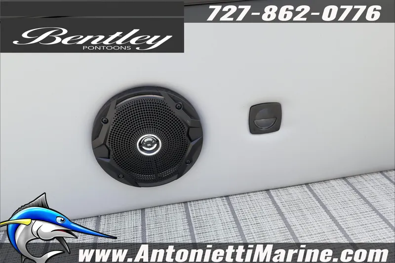 Slide: The Image of 2026 Bentley Pontoons Legacy 203 Swingback speaker detail with contact information and logo. - 21