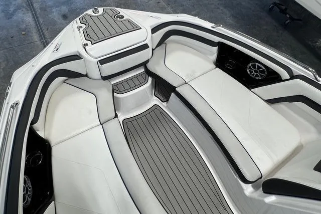 Slide: The Image of 2020 Yamaha Boats 242SE interior with sleek white seating and modern design. - 12