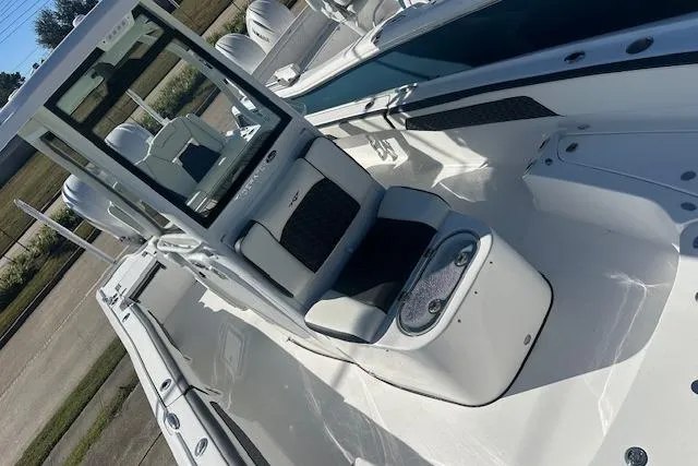 Slide: The Image of 2026 Tidewater 2700 Carolina Bay boat interior with seating and console, showcasing sleek design. - 10
