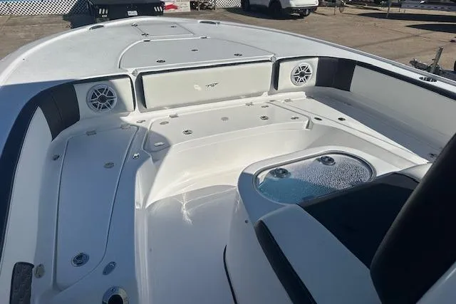 Slide: The Image of 2026 Tidewater 2700 Carolina Bay boat interior with seating and storage. - 11