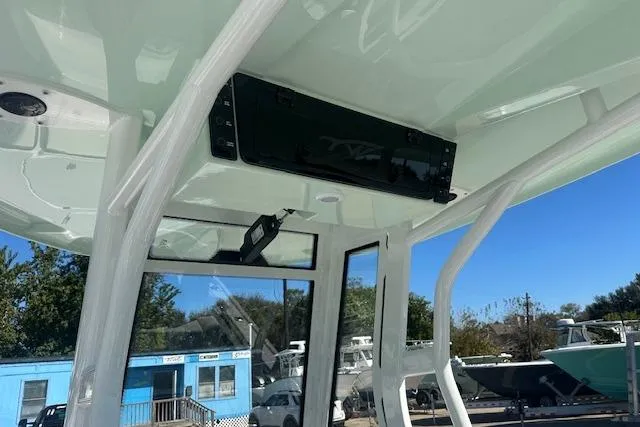 Slide: The Image of 2026 Tidewater 2700 Carolina Bay boat interior with electronics and sturdy framework. - 8
