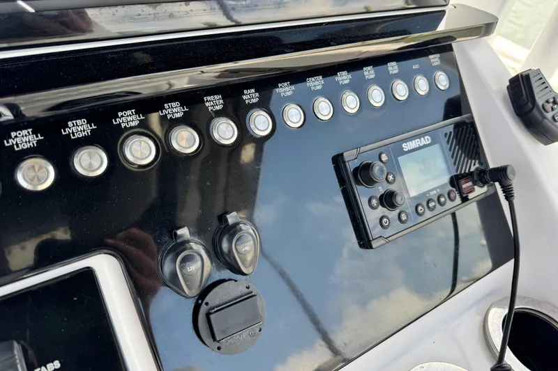 Slide: The Image of Control panel of a 2018 Fountain 34 Center Console boat with Simrad electronics. - 8