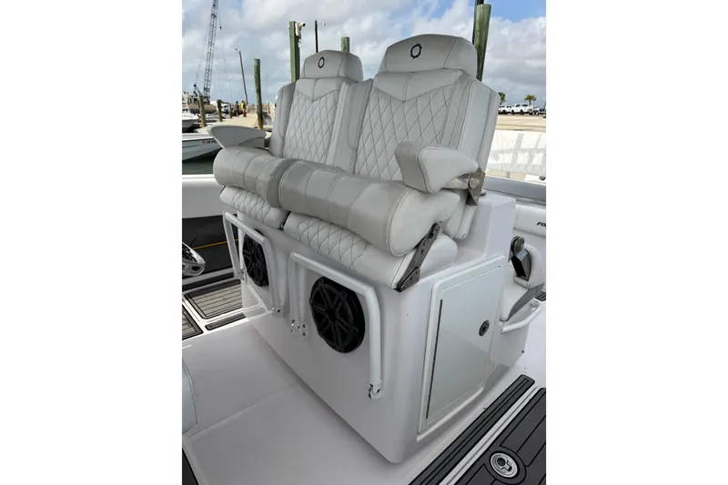 Slide: The Image of Luxurious seating on 2018 Fountain 34 Center Console boat with diamond-stitched upholstery. - 9