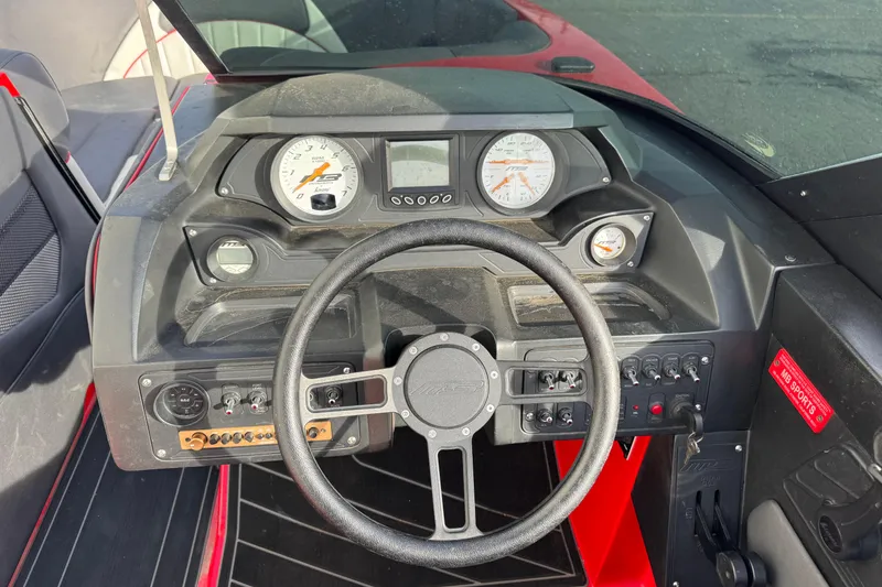 Slide: The Image of 2020 MB B52 23 Classic boat dashboard with steering wheel and gauges. - 7