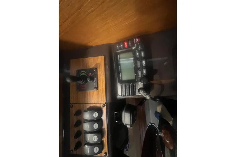 Slide: The Image of Control panel of 2020 Ranger Tugs R-27 Luxury Edition Tug with radio and switches. - 11