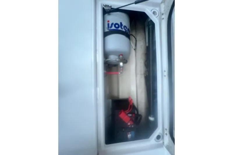 Slide: The Image of 2020 Ranger Tugs R-27 engine compartment with Isotemp water heater. - 18