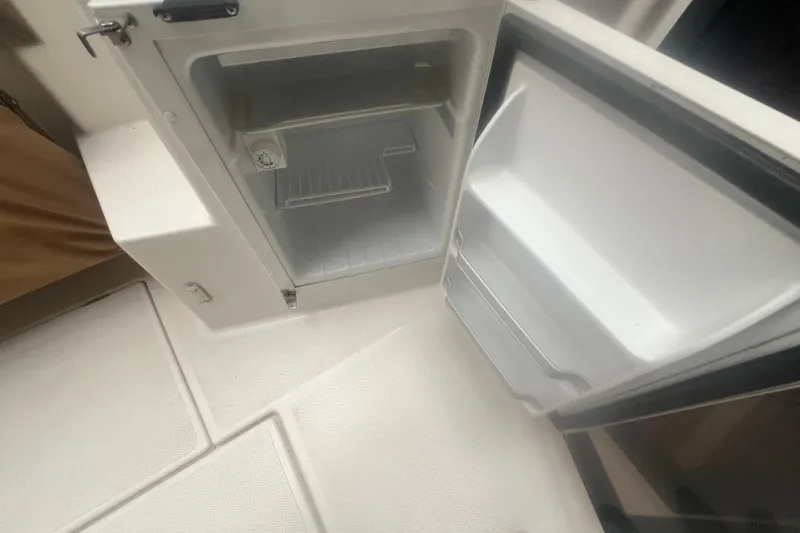 Slide: The Image of Open refrigerator in 2020 Ranger Tugs R-27 Luxury Edition Tug interior. - 21