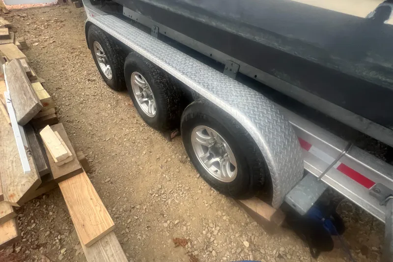 Slide: The Image of Trailer of 2020 Ranger Tugs R-27 Luxury Edition Tug on gravel. - 29