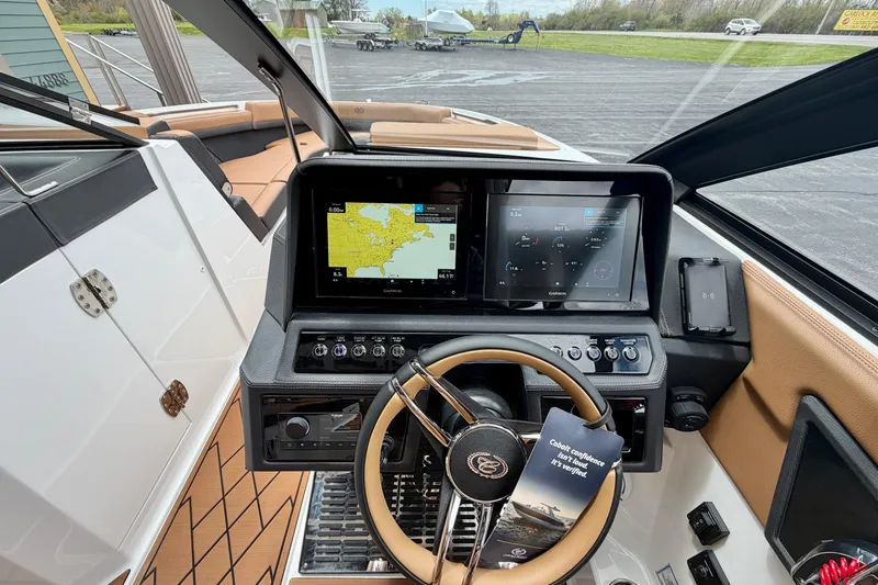 Slide: The Image of Interior view of 2026 Cobalt R8 Outboard boat with advanced navigation system and sleek design. - 18