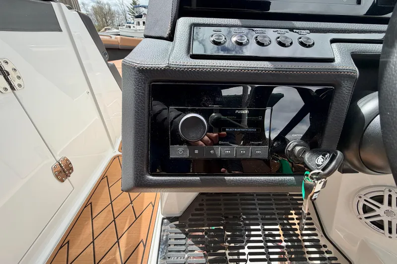 Slide: The Image of Dashboard of 2026 Cobalt R8 Outboard boat with audio system and ignition keys. - 20