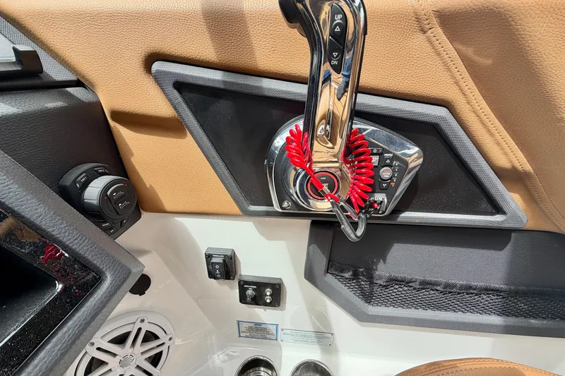 Slide: The Image of Control panel of 2026 Cobalt R8 Outboard boat with throttle and speaker. - 21