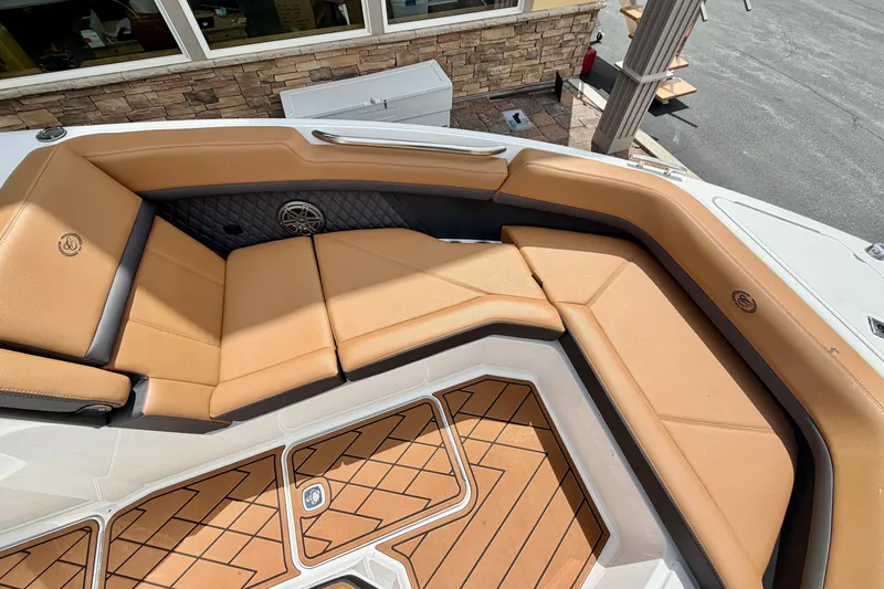 Slide: The Image of Luxurious seating on 2026 Cobalt R8 Outboard boat with tan upholstery and teak flooring. - 25