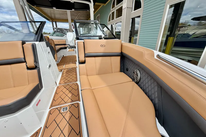 Slide: The Image of Luxurious interior of 2026 Cobalt R8 Outboard boat with tan leather seating and elegant design. - 26
