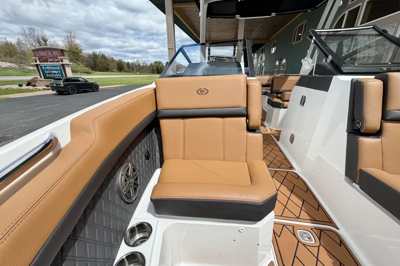 Slide: The Image of 2026 Cobalt R8 Outboard boat interior with tan leather seating and modern design. - 27
