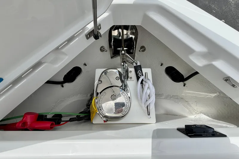 Slide: The Image of Anchor compartment of 2026 Cobalt R8 Outboard boat with winch and ropes. - 28