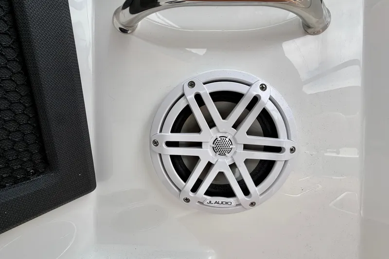 Slide: The Image of White JL Audio speaker on 2026 Cobalt R8 Outboard boat interior. - 30