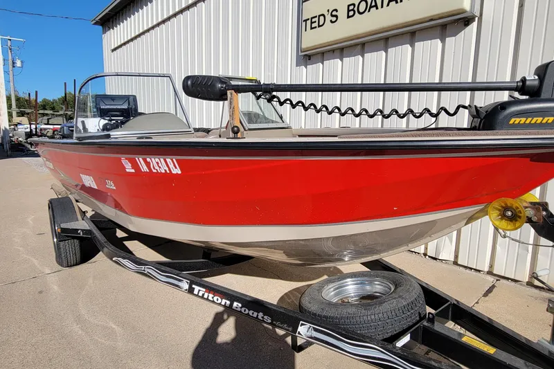 Slide: The Image of Red 2007 Triton DV 176 Mag boat on trailer outside Ted's Boating. - 0