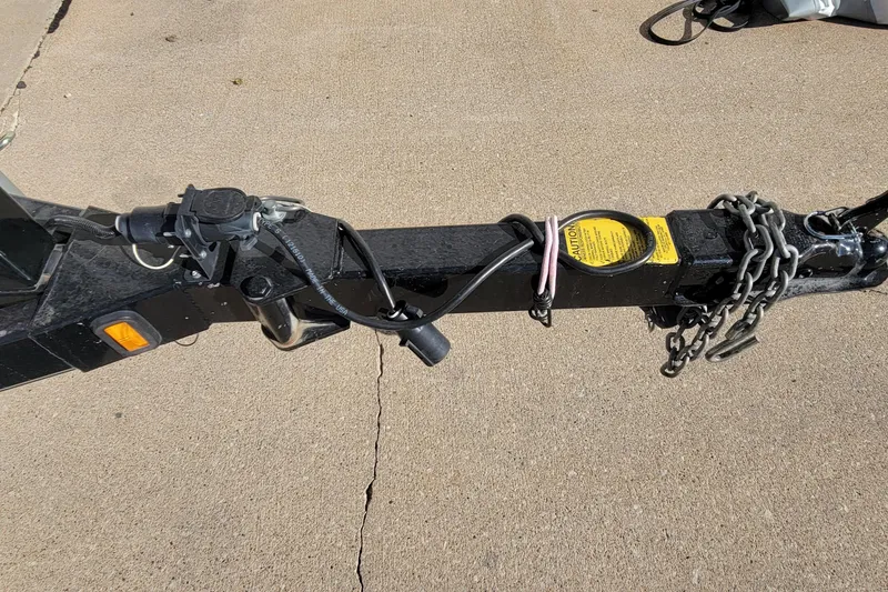 Slide: The Image of Trailer hitch of 2007 Triton DV 176 Mag with safety chains and wiring. - 11