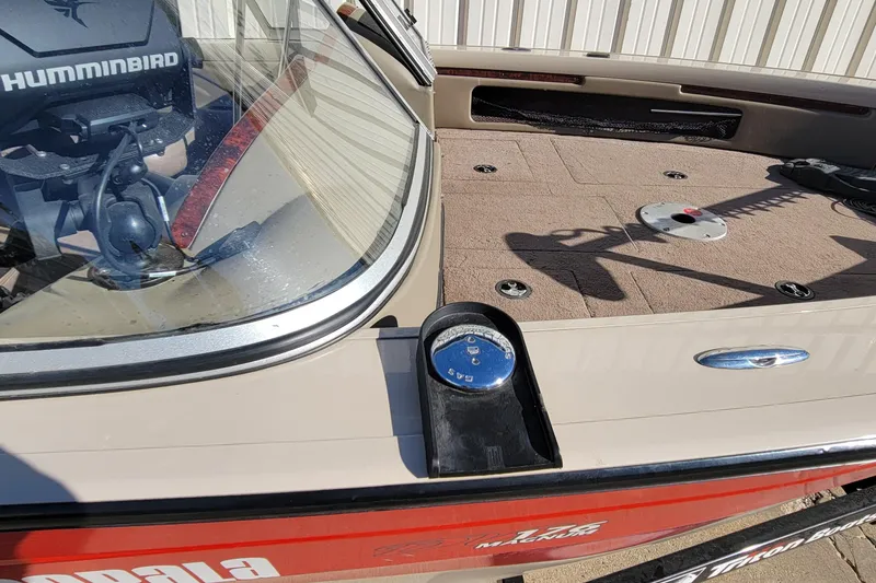 Slide: The Image of 2007 Triton DV 176 Mag boat deck with Humminbird equipment and storage compartments. - 12
