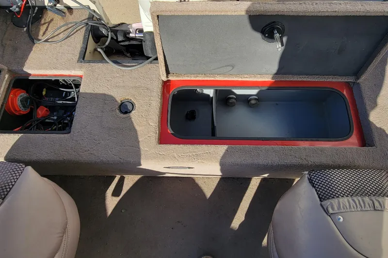 Slide: The Image of 2007 Triton DV 176 Mag boat interior with open storage compartments and seating. - 13