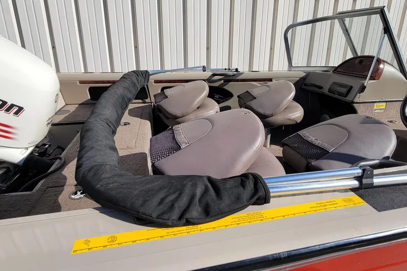 Slide: The Image of 2007 Triton DV 176 Mag boat interior with seating and motor detail. - 2