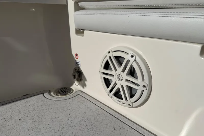 Slide: The Image of 2021 Pathfinder 2500 Hybrid boat interior with speaker and seating detail. - 14