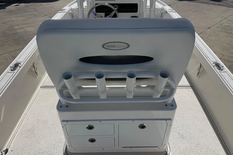 Slide: The Image of 2021 Pathfinder 2500 Hybrid boat interior with rod holders and storage compartments. - 15