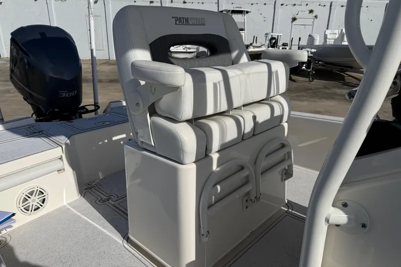 Slide: The Image of 2021 Pathfinder 2500 Hybrid boat interior with Yamaha 300 engine, featuring cushioned seating. - 16