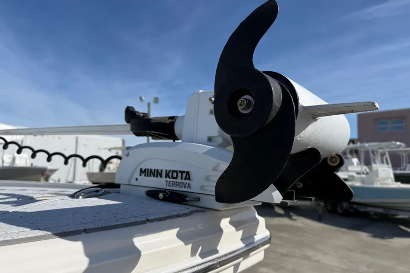 Slide: The Image of Minn Kota Terrova motor on 2021 Pathfinder 2500 Hybrid boat under clear blue sky. - 20