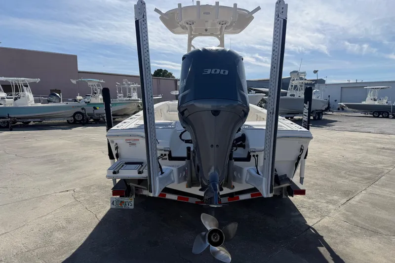 Slide: The Image of 2021 Pathfinder 2500 Hybrid boat with Yamaha 300 engine, parked in a marina. - 24