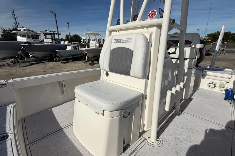 Slide: The Image of 2021 Pathfinder 2500 Hybrid boat interior with cushioned seating and storage. - 6