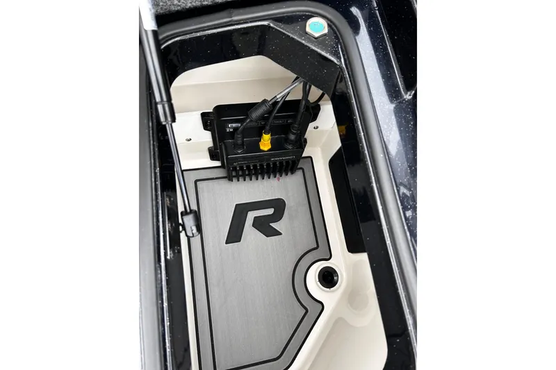Slide: The Image of 2023 Ranger Z520R Ranger Cup Equipped storage compartment with electronic connections. - 11