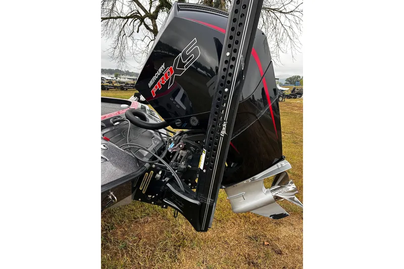 Slide: The Image of 2023 Ranger Z520R boat with Mercury Pro XS engine, parked on grass. - 20