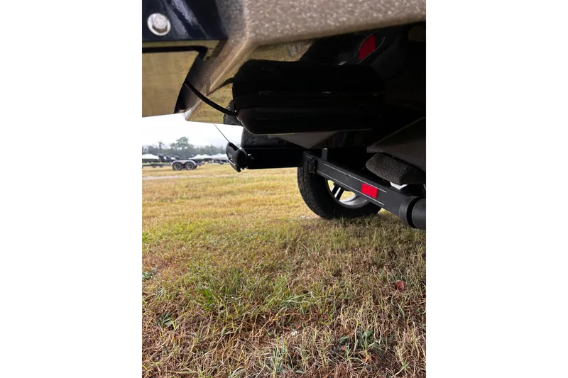 Slide: The Image of 2023 Ranger Z520R Ranger Cup trailer on grassy field, close-up view. - 23