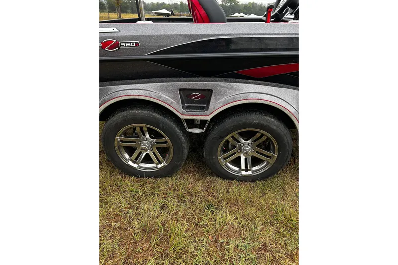 Slide: The Image of 2023 Ranger Z520R Ranger Cup Equipped boat trailer with dual wheels on grass. - 24