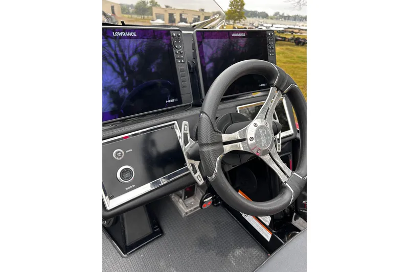 Slide: The Image of 2023 Ranger Z520R boat dashboard with steering wheel and Lowrance displays. - 29