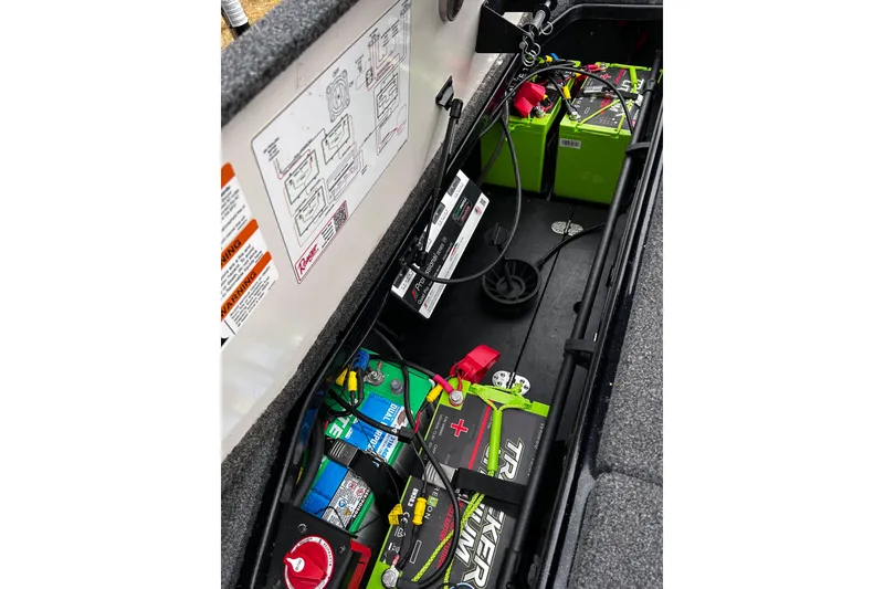Slide: The Image of 2023 Ranger Z520R Ranger Cup Equipped boat battery compartment with wiring and labels. - 3