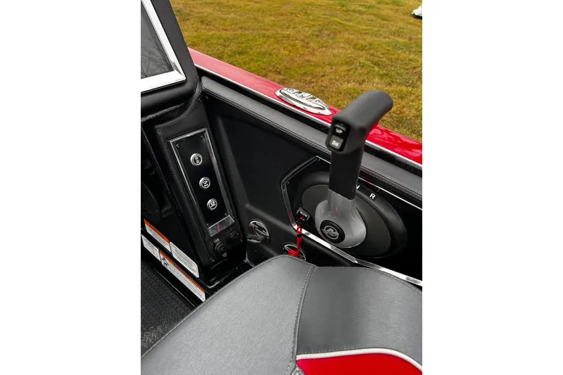 Slide: The Image of 2023 Ranger Z520R Ranger Cup Equipped boat control panel and throttle lever. - 31