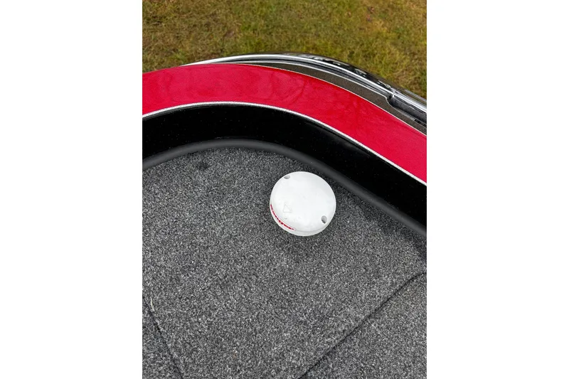 Slide: The Image of 2023 Ranger Z520R boat deck with red and black trim, featuring a white fixture. - 5