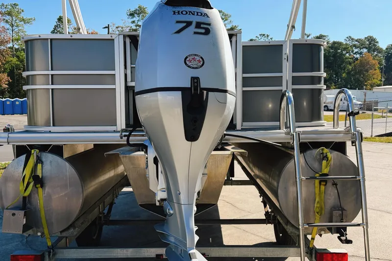 Slide: The Image of 2020 Sylvan Mirage Fish 820 Party Fish interior with plush seating and table. - 11