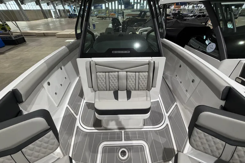 Slide: The Image of 2026 Monterey Elite 30 OB boat interior with luxurious seating and modern design. - 17
