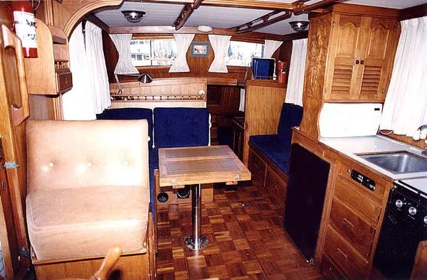 Slide: The Image of Interior of a 1979 CHB Double Cabin Trawler with wooden furnishings. - 2