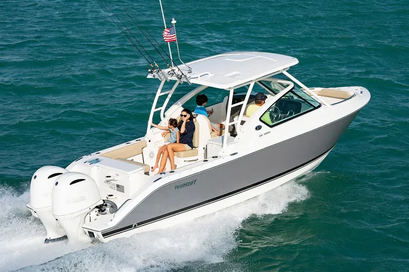 Slide: The Image of Manufacturer Provided Image: 2025 Pursuit DC 266 Dual Console boat cruising on open water. - 0